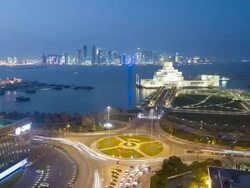 WS POV T/L View  Museum of Islamic Art and Dhow harbour   at night / Doha, Qatar Stock Footage
