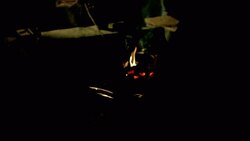 A monk stokes a fire near a prisoner on a torture rack in a reenactment of the Inquisition. Stock Footage