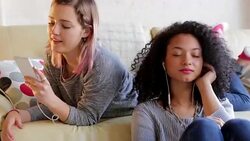 Teen headphone share Stock Footage