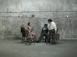 People in chairs waiting for man to arrive Stock Footage