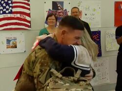 Family Welcoming Soldier Home from War Stock Footage