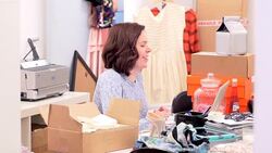 Fashion buyer video conferencing at desk Stock Footage