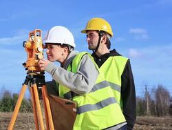 Land surveyors on construction site Stock Footage