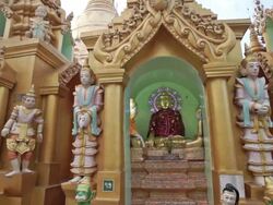 Colorful, religious statues in the Shwedagon in Yangon, Myanmar Stock Footage