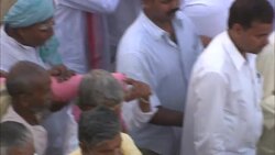 Crowds follow a marching band during Diwali in India. Stock Footage