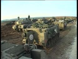 Night-time and early morning pix of troops, tanks News Clip
