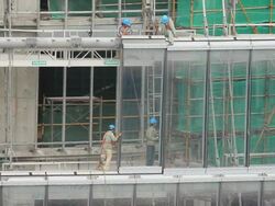 MS View of construction worker working on skyscraper / Shanghai,  China  Stock Footage