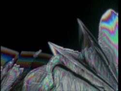 T/L CU colourful crystals grow across frame Stock Footage