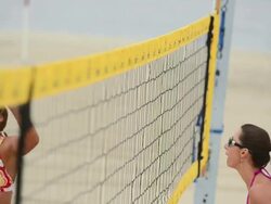 MS TU TD Women playing beach volleyball at net / Redondo Beach, California, United States Stock Footage