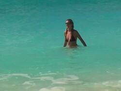 Young lady relaxing in the ocean Stock Footage