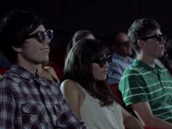 Young couple watching 3d movie at the movie theater Stock Footage