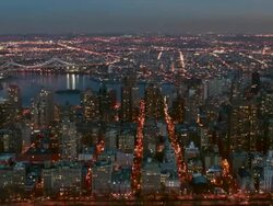 Aerial of north east end of Central Park looking out at upper East side and Queens at night, NYC Stock Footage