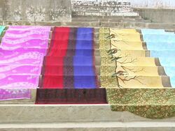 MS Colorful sarees drying on steps / Varanasi, Uttar Pradesh, India Stock Footage