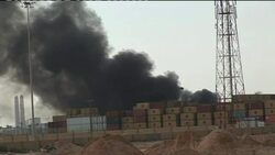 Smoke from port after attack, migrants waiting, port damage Instructional Video