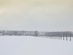 WS PAN View of Auschwitz II Birkenau with tower with snow rain / Auschwitz-Birkenau, Krakow, Poland Stock Footage