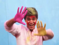 Young man celebrating holi festival Stock Footage