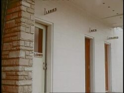 Three restrooms indicate Ladies, Mens and Colored Rest Room. Stock Footage