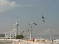 WS View of Expo with cable cars and bridge in background / Lisbon, Portugal Stock Footage