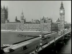 1943: LONDON, ENGLAND: XHA WS Houses of Parliament, Clock tower housing Big Ben & Westminster Bridge w/ traffic, cars double-decker buses FG. (possibly before 1940 German Luftwaffe Blitz, Blitzkrieg, WWII) Instructional Video