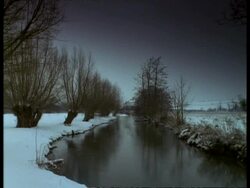 T/L River Windrush in snow, January, Lapse time Stock Footage
