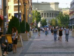 MS Painter sitting and painting beside of street / Yerevan, Armenia Stock Footage