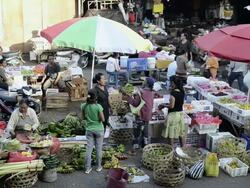MS Vendor selling fruits in crowded market area / Ubud, Bali, Indonesia Stock Footage