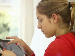 Digital tablet girl at home. Stock Footage