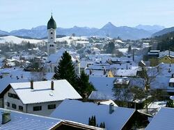 WS Shot of snow on roof on houses in town in winter / Nesselwang, Bavaria, Germany Stock Footage