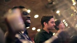 Friends drink in Vegas casino and crank slot machines in a row Stock Footage