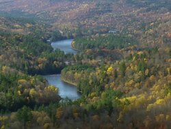 WS ARIEAL View of Meandering lake in forest /Maine, United States Stock Footage