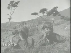 1950: KOREAN WAR: BATTLE OF TAEGU: VS United States tank regiment firing on hills, mountains in Taegu, various Marines & soldiers in bushes, one firing rocket launcher, another resting w/ dirt on face, soldiers in defensive positions. South Korea Instructional Video