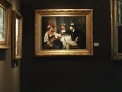 panning past paintings at an art gallery Stock Footage