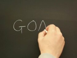 Writing 'Goals' on the blackboard Stock Footage