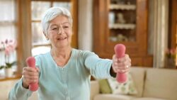 LD shot of senior woman exercising at home Stock Footage