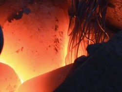 Melting Metal in the Foundry:(ZOOM) Stock Footage