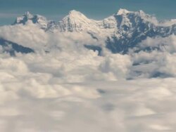 T/L AERIAL shot across Himalayas, above the clouds Stock Footage