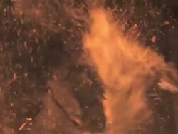 M/S Horses and riders crossing the fire Stock Footage