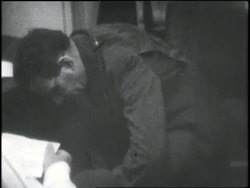 German spy Frederick Joubert Duquesne removes documents from his sock and gives them to an undercover agent. News Clip