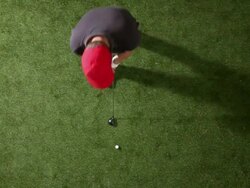 MS, Lockdown, golfer swinging club and hitting golf ball, overhead view Stock Footage