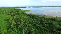 Moving forward over Manra lagoon with reflections Stock Footage
