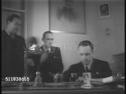 1940: NEW YORK ITALIAN AMERICANS: DRAMATIZATION: Three men in office, one making notes at desk. NEW YORK PAPER: EXT. 'Il Progresso Italo-Americano' daily newspaper building. Front pages of Italian language newspaper 'Il Progresso Italo-Americano' Instructional Video