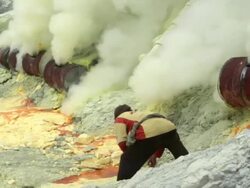 MS Miners working on the sulfur extraction at Ijen volcano crater / Ijen, Java, Indonesia Stock Footage