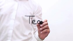 Hand Writing 'Teamwork' Stock Footage