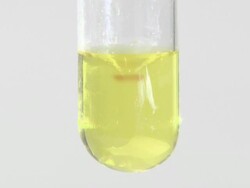 Iron (III) hydroxide precipitate, formed as sodium hydroxide is dripped into iron (III) chloride solution Stock Footage