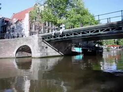 WS POV View of boat moving through canal / Amsterdam, The Netherlands, Holland Stock Footage