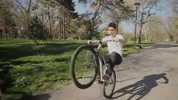 Amazing bike ride on one wheel Stock Footage