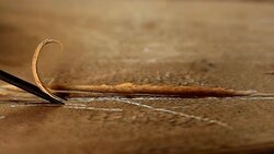 Worker using a carving knife to carving on a wood Stock Footage
