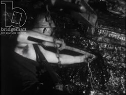 Miners working inside the coal mine. France, 1952 Stock Footage
