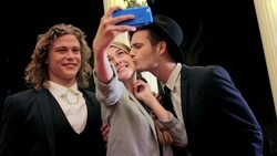Boy band celebrities taking selfie with fan Stock Footage
