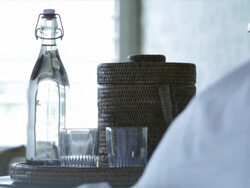 hotel resort getaway lodge bedroom bed sheets bedside table water glasses water bottle icebucket Stock Footage